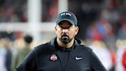 Nov 15, 2025; Columbus, Ohio, USA;  Ohio State Buckeyes head coach Ryan Day watches his team warms up before the game against the UCLA Bruins at Ohio Stadium. Mandatory Credit: Joseph Maiorana-Imagn Images