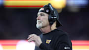 Aug 8, 2025; Foxborough, Massachusetts, USA; Washington Commanders head coach Dan Quinn reacts during the first half against the New England Patriots at Gillette Stadium. Mandatory Credit: Paul Rutherford-Imagn Images