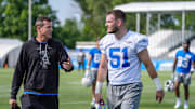 LB Ben Niemann walks off the field special teams coordinator Dave Fipp during day two of the Detroit Lions training camp at the Detroit Lions Headquarters in Dearborn, Mich. on Thursday, July 25, 2024.