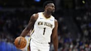 Feb 3, 2025; Denver, Colorado, USA; New Orleans Pelicans forward Zion Williamson (1) controls the ball in the second quarter against the Denver Nuggets at Ball Arena. Mandatory Credit: Ron Chenoy-Imagn Images