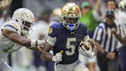 Oct 19, 2024; Atlanta, Georgia, USA; Notre Dame Fighting wide receiver Beaux Collins (5) runs against Georgia Tech Yellow Jackets linebacker Jackson Hamilton (17) during the first half at Mercedes-Benz Stadium.  