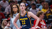 Jun 17, 2025; Indianapolis, Indiana, USA; Indiana Fever guard Caitlin Clark (22)  and head coach Stephanie White in the first half against the Connecticut Sun at Gainbridge Fieldhouse. Mandatory Credit: Trevor Ruszkowski-Imagn Images