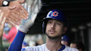 Oct 2, 2025; Chicago, Illinois, USA; Chicago Cubs outfielder Kyle Tucker (30) is greeted in the dugout after scoring against the San Diego Padres during game three of the Wildcard round for the 2025 MLB playoffs at Wrigley Field. Mandatory Credit: David Banks-Imagn Images