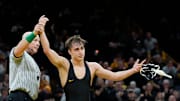 Iowa’s Drake Ayala defeats Iowa State’s Evan Frost in a 133-pound match during the Cy-Hawk wrestling dual on Saturday, Nov. 23, 2024, at Carver-Hawkeye Arena in Iowa City, Iowa.