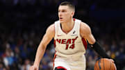 Dec 21, 2024; Orlando, Florida, USA; Miami Heat guard Tyler Herro (14) drives to the basket against the Orlando Magic in the second quarter at Kia Center. Mandatory Credit: Nathan Ray Seebeck-Imagn Images