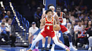 Oct 17, 2024; Oklahoma City, Oklahoma, USA; Atlanta Hawks guard Kobe Bufkin (4) moves the ball around Oklahoma City Thunder forward Ousmane Dieng (13) during the second half at Paycom Center. Mandatory Credit: Alonzo Adams-Imagn Images