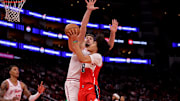 Nov 12, 2025; Houston, Texas, USA; Washington Wizards forward Kyshawn George (18) shoots inside against Houston Rockets center Alperen Sengun (28) during the third quarter at Toyota Center. Mandatory Credit: Erik Williams-Imagn Images