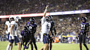 Sep 30, 2023; Fort Worth, Texas, USA; West Virginia Mountaineers quarterback Garrett Greene (6) reacts after scoring a touchdown against the TCU Horned Frogs in the third quarter at Amon G. Carter Stadium. Mandatory Credit: Tim Heitman-Imagn Images
