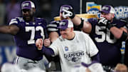Dec 28, 2023; Orlando, FL, USA;  Kansas State Wildcats head coach Chris Klieman celebrates after beating the North Carolina State Wolfpack in the Pop-Tarts bowl at Camping World Stadium. Mandatory Credit: Nathan Ray Seebeck-Imagn Images