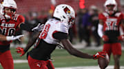 Louisville’s Jaleel Skinner catches the ball and scores the touchdown against Louisville’s Jaiden Spearman Friday night at L&N Stadium
