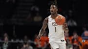 Mar 11, 2025; Charlotte, NC, USA; Florida State Seminoles guard Jamir Watkins (1) brings the ball up court against the Syracuse Orange during the second half at Spectrum Center.