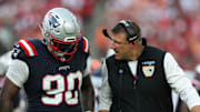 Nov 9, 2025; Tampa, Florida, USA; New England Patriots defensive tackle Christian Barmore (90) talks with head coach Mike Vrabel during the third quarter against the Tampa Bay Buccaneers at Raymond James Stadium. Mandatory Credit: Nathan Ray Seebeck-Imagn Images