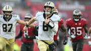 Dec 7, 2025; Tampa, Florida, USA; New Orleans Saints quarterback Tyler Shough (6) runs for a gain during the third quarter against the Tampa Bay Buccaneers at Raymond James Stadium. Mandatory Credit: Nathan Ray Seebeck-Imagn Images