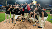 Brewers pitchers celebrate their 3-1 win over the Cubs in Game 5 of the NLDS at American Family Field.