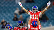 Mississippi Rebels wide receiver Jordan Watkins (11) is hoisted up by offensive lineman Reece McIntyre (56) for his touchdown score during the fourth quarter of the TaxSlayer Gator Bowl Thursday, Jan. 2, 2025 at EverBank Stadium in Jacksonville, Fla. Ole Miss defeated Duke 52-20. [Corey Perrine/Florida Times-Union]