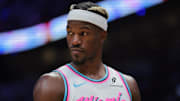 Jan 17, 2025; Miami, Florida, USA; Miami Heat forward Jimmy Butler (22) looks on against the Denver Nuggets during the third quarter at Kaseya Center. Mandatory Credit: Sam Navarro-Imagn Images