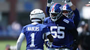 New York Giants wide receiver Malik Nabers celebrates with offensive tackle James Hudson III during training camp at Quest Diagnostics Training Center. 