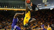 Iowa Hawkeyes forward Ladji Dembele (13) drives to the basket against the Washington Huskies Saturday, Feb. 22, 2025 at Carver-Hawkeye Arenain Iowa City, Iowa.
