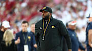 Sep 6, 2025; Norman, Oklahoma, USA; Michigan Wolverines head coach Sherrone Moore stands on the sideline prior to a game against the Oklahoma Sooners at Gaylord Family-Oklahoma Memorial Stadium. Mandatory Credit: Kevin Jairaj-Imagn Images