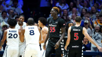 Xavier Musketeers forward Abou Ousmane (24), background, reacts after drawing a foul against