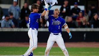 Trinity Christian's Gage Petrutz (1) taps helmets with Trinity Christian's Parker Loew (9) after a solo home run during the third inning of a high school baseball matchup Thursday, March 20, 2025 at Trinity Christian Academy in Jacksonville, Fla. The duo have helped their team move up to No. 7 on our latest rankings and in the semifinals of the Florida Class 2A Playoffs.