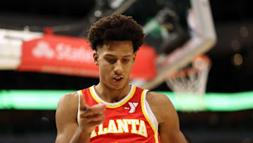 Jalen Johnson points to the camera against the Milwaukee Bucks