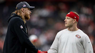 San Francisco 49ers tight end George Kittle (L) and running back Christian McCaffrey (R)