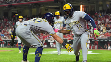 Milwaukee Brewers players Sal Frelick and Andruw Monasterio celebrate against the Cincinatti Reds.