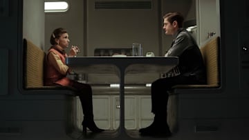 (L-R): Eedy Karn (Kathryn Hunter) and Syril Karn (Kyle Soller) in Lucasfilm's ANDOR, exclusively on Disney+. ©2022 Lucasfilm Ltd. & TM. All Rights Reserved.