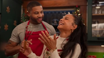 Meet Me Next Christmas. (L to R) Devale Ellis as Teddy and Christina Milian as Layla in Meet Me Next Christmas. 