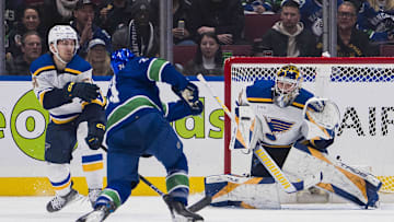 Jan 24, 2024; Vancouver, British Columbia, CAN; St. Louis Blues goalie Joel Hofer (30) prepares to make as save on Vancouver Canucks forward Pius Suter (24) in the first period at Rogers Arena. Mandatory Credit: Bob Frid-Imagn Images