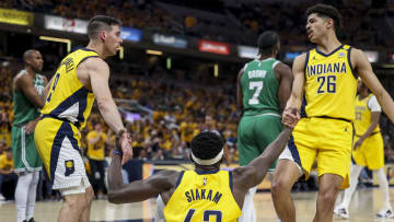 May 27, 2024; Indianapolis, Indiana, USA; Indiana Pacers guard Ben Sheppard (26) and Indiana Pacers guard T.J. McConnell (9) help Indiana Pacers forward Pascal Siakam (43) stand up during the second quarter during game four of the eastern conference finals for the 2024 NBA playoffs at Gainbridge Fieldhouse. Mandatory Credit: Trevor Ruszkowski-USA TODAY Sports