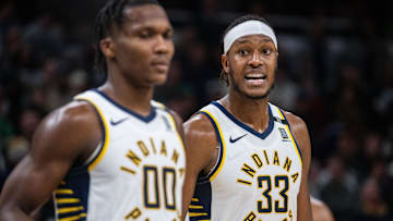 Jan 8, 2024; Indianapolis, Indiana, USA; Indiana Pacers center Myles Turner (33) talks to guard Bennedict Mathurin (00) after a timeout  in the second half against the Boston Celtics at Gainbridge Fieldhouse. Mandatory Credit: Trevor Ruszkowski-Imagn Images