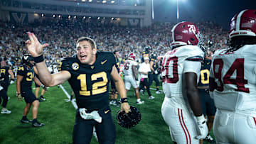 Vanderbilt Commodores quarterback Brennan Storer (12) celebrates after knocking off the Alabama Crimson Tide 40-35 at Vanderbilt Stadium in Nashville, Tenn., Saturday, Oct. 5, 2024.