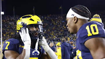 Oct 26, 2024; Ann Arbor, Michigan, USA;  Michigan Wolverines running back Donovan Edwards (7) and  quarterback Alex Orji (10) celebrate after defeating the Michigan State Spartans at Michigan Stadium. Mandatory Credit: Rick Osentoski-Imagn Images