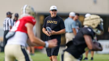 New Orleans Saints head coach Kellen Moore looks on  during training camp 