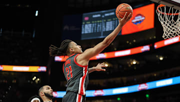 Dec 14, 2024; Atlanta, Georgia, USA; Ohio State Buckeyes forward Devin Royal (21) shoots the ball against the Auburn Tigers at State Farm Arena. Mandatory Credit: Jordan Godfree-Imagn Images