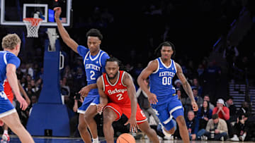 Dec 21, 2024; New York, New York, USA; Ohio State Buckeyes guard Bruce Thornton (2) brings the ball up court while being defended by Kentucky Wildcats guard Jaxson Robinson (2) during the second half at Madison Square Garden. Mandatory Credit: John Jones-Imagn Images