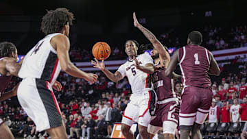 Nov 10, 2024; Athens, Georgia, USA; Georgia Bulldogs guard Silas Demary Jr. (5) passes there ball to forward Asa Newell (14) against Texas Southern Tigers forward Grayson Carter (25) during the first half at Stegeman Coliseum. Mandatory Credit: Dale Zanine-Imagn Images