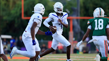 IMG Academy's Jayden Wade (7) looks to pass during the first quarter of a high school football matchup at Mandarin High School, Friday, Sept. 19, 2025, in Jacksonville, Fla. The IMG Academy Ascenders defeated the Mandarin Mustangs 57-7.