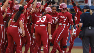 Oklahoma outfielder Kasidi Pickering (7) celebrates after hitting a home run in the second inning of Game 2 of the NCAA softball Women's College World Series Championship Series. 