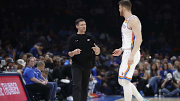 Oct 9, 2024; Oklahoma City, Oklahoma, USA; Oklahoma City Thunder head coach Mark Daigneault talks to center Isaiah Hartenstein (55) during the first quarter against Houston at Paycom Center. Mandatory Credit: Alonzo Adams-Imagn Images