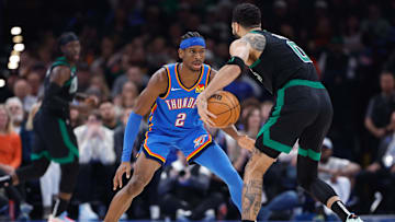 Jan 2, 2024; Oklahoma City, Oklahoma, USA; Oklahoma City Thunder guard Shai Gilgeous-Alexander (2) defends Boston Celtics forward Jayson Tatum (0) during the second quarter at Paycom Center. Mandatory Credit: Alonzo Adams-Imagn Images
