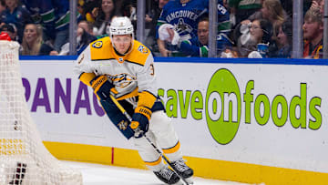 Apr 21, 2024; Vancouver, British Columbia, CAN; Nashville Predators defenseman Jeremy Lauzon (3) handles the puck against the Vancouver Canucks during the third period in game one of the first round of the 2024 Stanley Cup Playoffs at Rogers Arena. Canucks won 4 - 2. Mandatory Credit: Bob Frid-Imagn Images