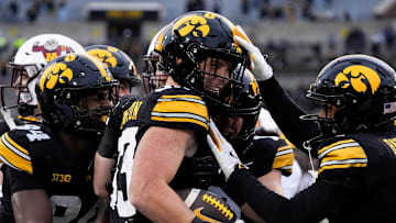 Teammates congratulate Iowa Hawkeyes linebacker Cam Buffington (33) after he intercepted a pass during a game against the Minnesota Golden Gophers Oct. 25, 2025 at Kinnick Stadium in Iowa City, Iowa.