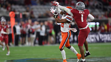 Dec 27, 2024; San Diego, CA, USA; Washington State Cougars defensive back Stephen Hall (1) deflects the ball from Syracuse Orange wide receiver Darrell Gill Jr. (82) during the first quarter at Snapdragon Stadium. Mandatory Credit: Abe Arredondo-Imagn Images