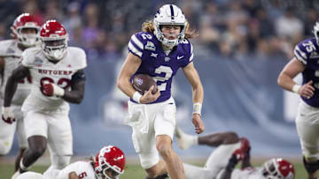 Dec 26, 2024; Phoenix, AZ, USA; Kansas State Wildcats quarterback Avery Johnson (2) runs the ball against the Rutgers Scarlet Knights during the second half of the Rate Bowl at Chase Field. Mandatory Credit: Mark J. Rebilas-Imagn Images