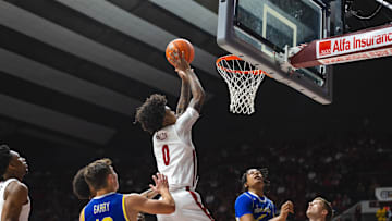 Dec 29, 2024; Tuscaloosa, Alabama, USA; Alabama Crimson Tide guard Labaron Philon (0) attempts a shot against the South Dakota State Jackrabbits during the first half at Coleman Coliseum. Mandatory Credit: Will McLelland-Imagn Images
