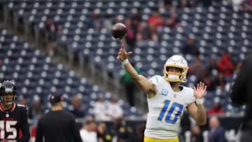 Jan 11, 2025; Houston, Texas, USA; Los Angeles Chargers quarterback Justin Herbert (10) warms up prior to the game against Houston Texans in an AFC wild card game at NRG Stadium. Mandatory Credit: Thomas Shea-Imagn Images