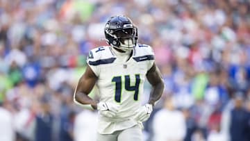 Dec 8, 2024; Glendale, Arizona, USA; Seattle Seahawks wide receiver DK Metcalf (14) against the Arizona Cardinals at State Farm Stadium. Mandatory Credit: Mark J. Rebilas-Imagn Images
